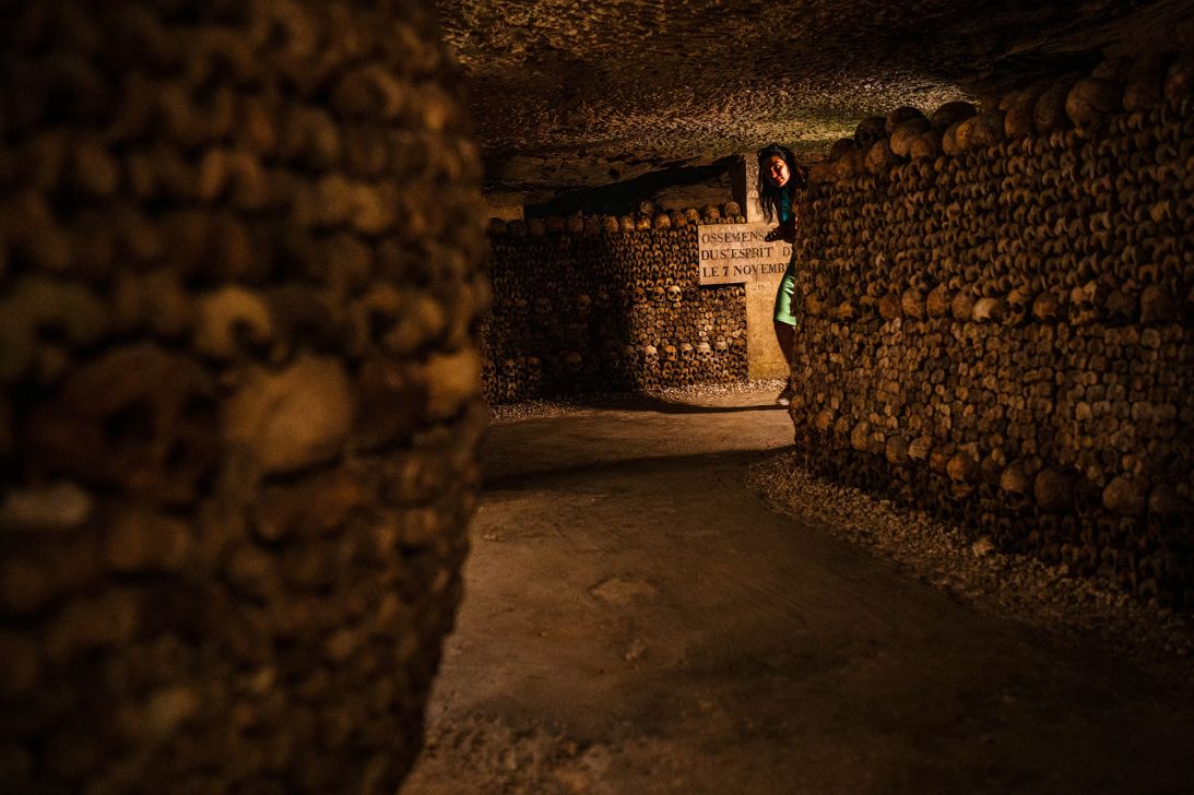 Skulls adorn the walls of the Paris Catacombs.