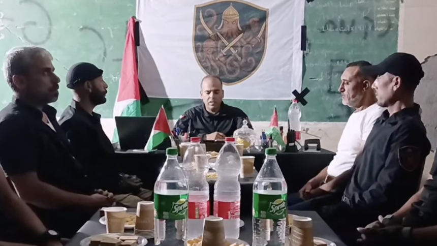 Leader of the Popular Defense Army, Rami Hallas, reading a statement