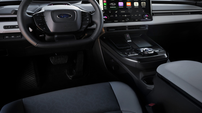 A look at the dashboard of the new Trailseeker with Apple CarPlay on its big center screen and a view of mountains out the windshield