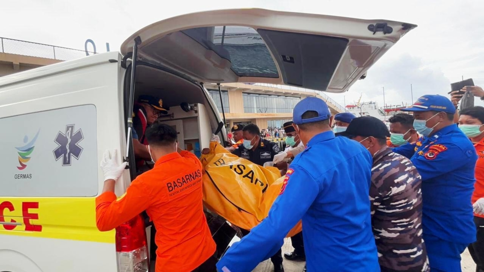 Indonesian rescuers find a body while searching for soccer coach and 3 children