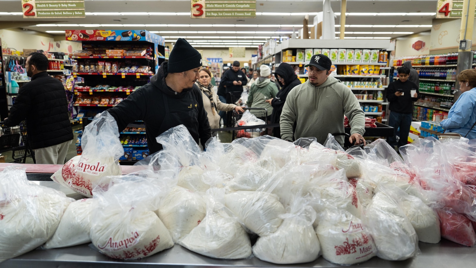  Families wait in line for hours to buy masa for tamales at beloved LA grocer