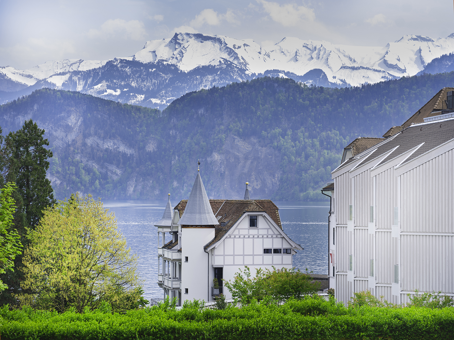 Chenot Palace Weggis on Lake Lucerne with the Swiss Alps in the background.