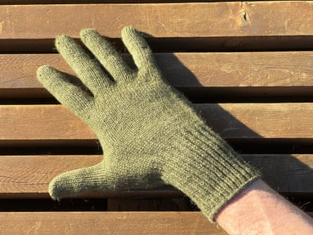 a person wearing ATG MaxiFlex Ultimate Work Gloves and wool liners