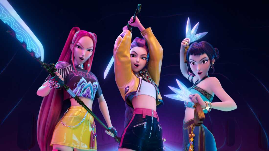 A still from the animated movie Kpop Demon Hunters shows superstars Rumi, Mira and Zoey wielding glowing weapons.