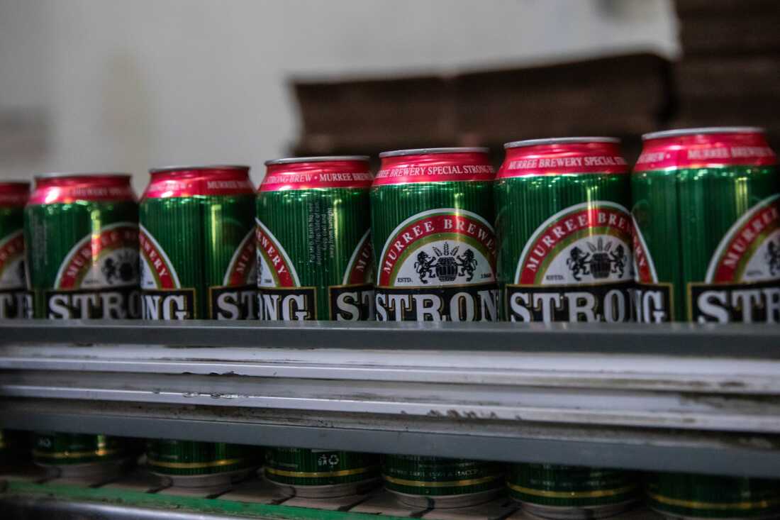 Cans of beer move down a production line at the Murree Brewery factory on Nov. 29, 2025 in Rawalpindi, Pakistan.