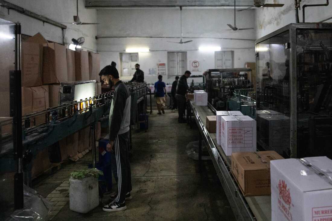 Workers stand in the factory where alcohol is produced at Murree Brewery on Nov. 29, 2025 in Rawalpindi, Pakistan.