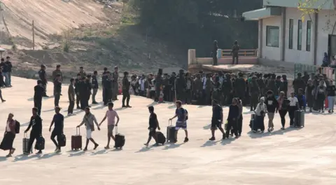 EPA People who were rescued from scam centers in Myanmar arrive in Thailand, at the Myanmar-Thai border of Phop Phra district, near Mae Sot, Tak province, northern Thailand, 12 February 2025