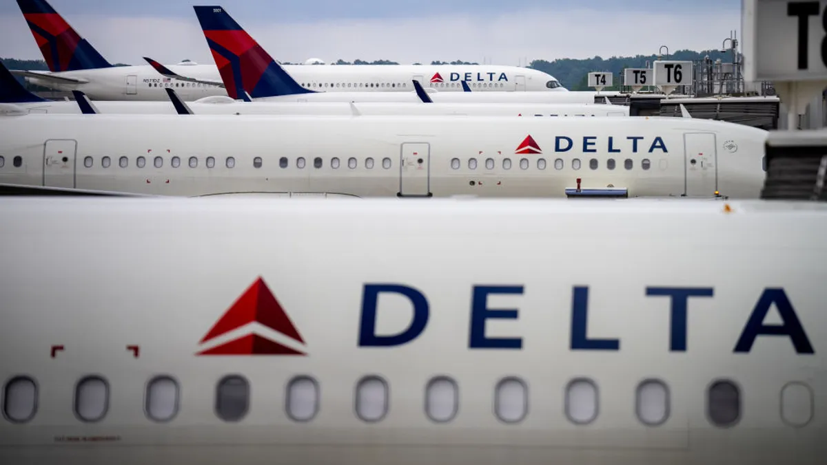  Car crashes through glass doors of Delta check-in at DTW