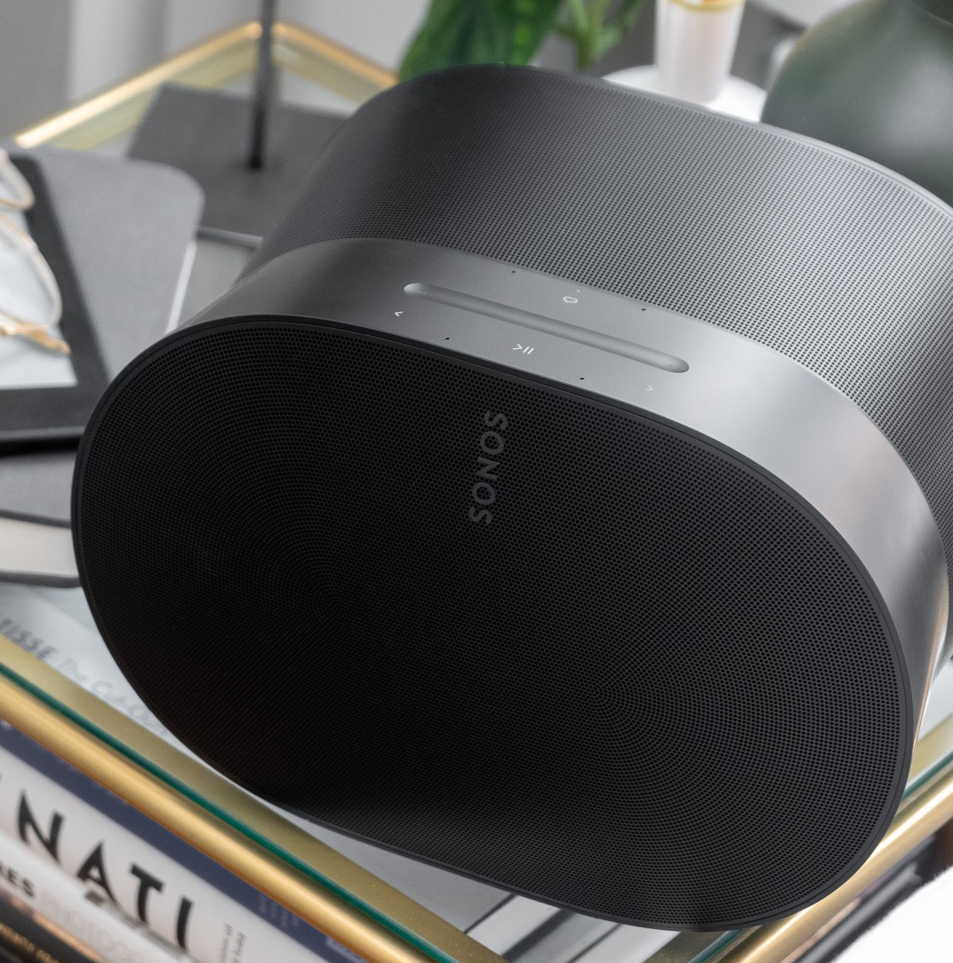 A photo of the Sonos Era 300 on a bedside table.