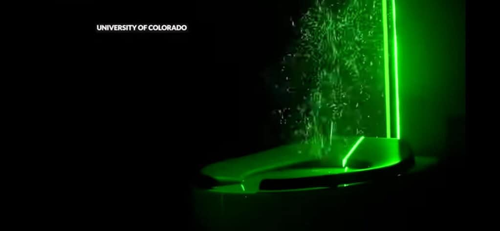 Visualization of aerosol dispersion from a toilet flush using green laser.