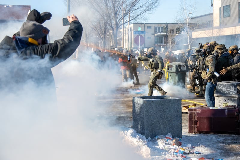Protesters clash with law enforcement after a federal agent shot and killed a man on Jan. 24, 2026