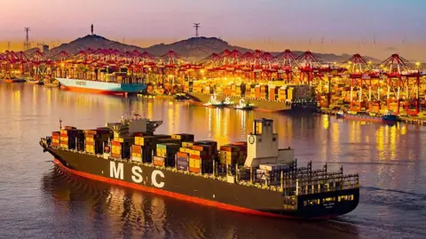 AFP via Getty Images A cargo ship leaving the the Yangshan Deepwater Port Container Terminal in Shanghai