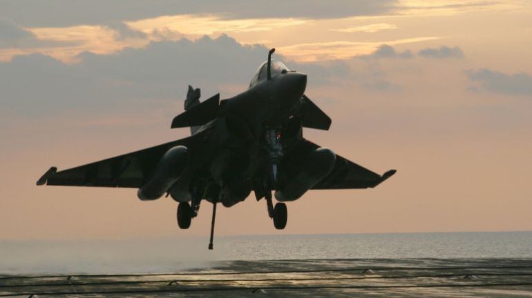 A French Navy Rafale jet fighter prepares to land on the Charles de Gaulle aircraft carrier on April 20, 2011 in the Mediteranean sea, as part of the military operations of the Nato coalition in Libya
