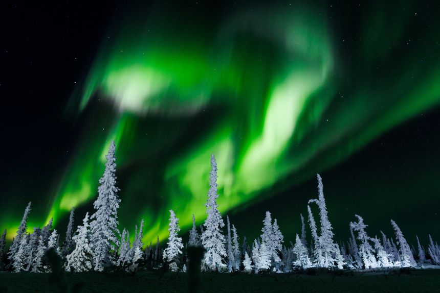 Northern lights — seen here north of Inuvik, in Canada's Northwest Territories — occur when energized particles from coronal mass ejections reach Earth’s magnetic field and interact with atmospheric gases.