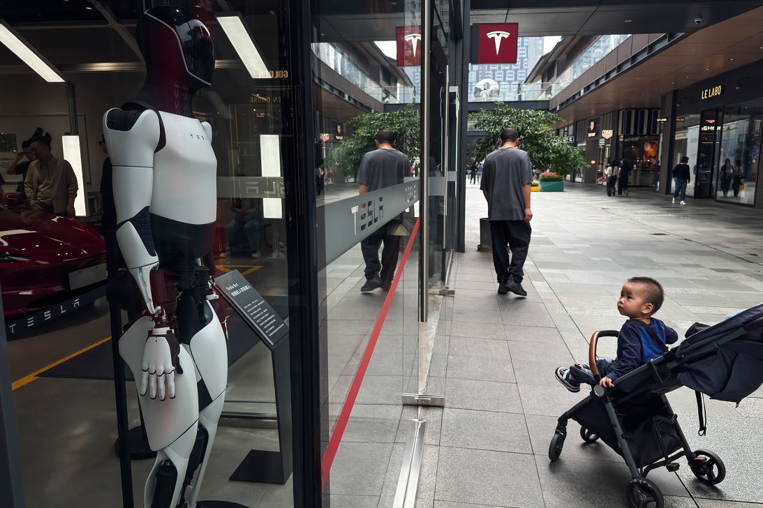A Tesla humanoid robot is displayed inside a Tesla store in Chengdu, China.