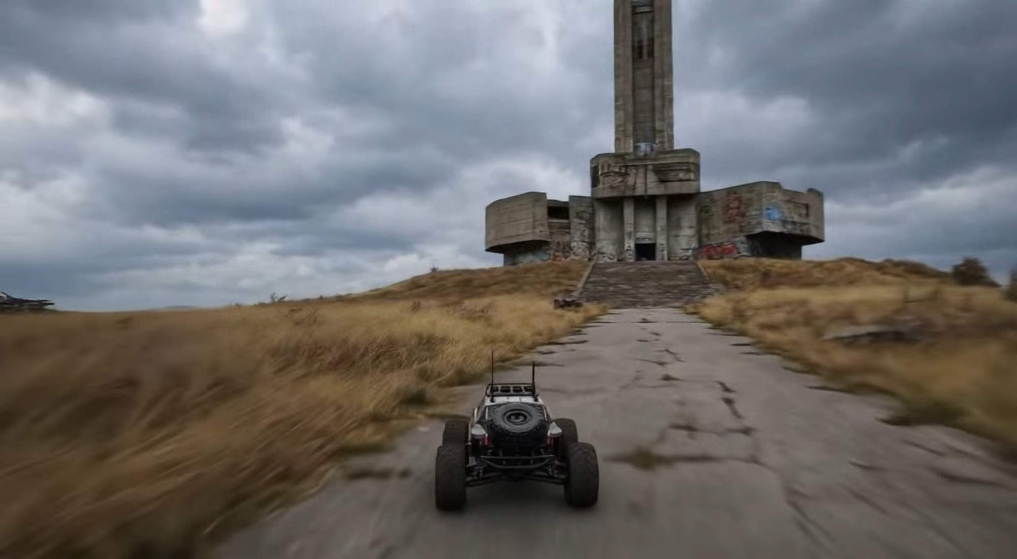 a remote control car on a path in a world created by project genie