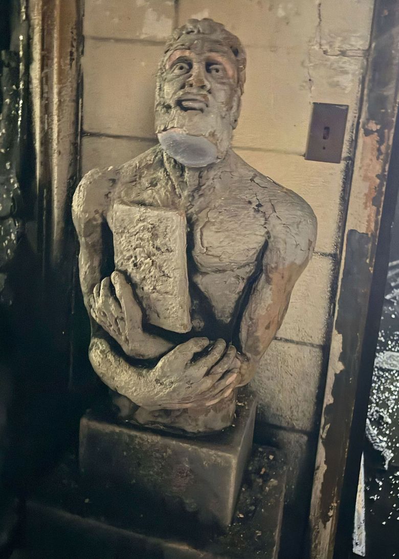 The Moses sculpture is seen, dirty but intact, right after the fire.
