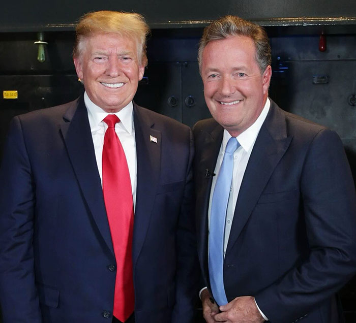 Donald Trump and Piers Morgan smiling together, with Piers Morgan blaming Trump for serious injury incident.