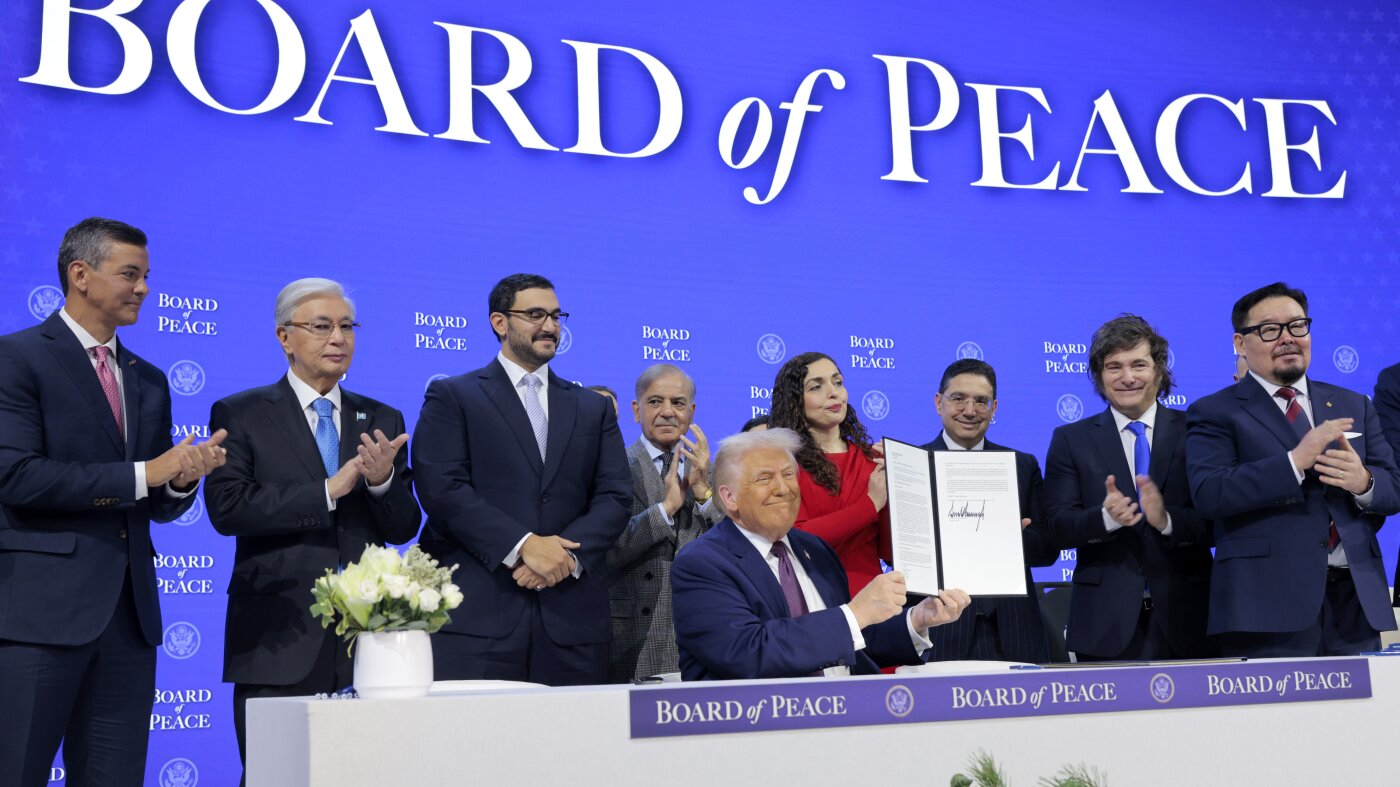  Trump signs Board of Peace charter at Davos as allies split on Gaza plan : NPR