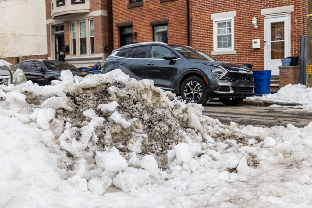 A pile of snow sits on the side of a road in Philadelphia