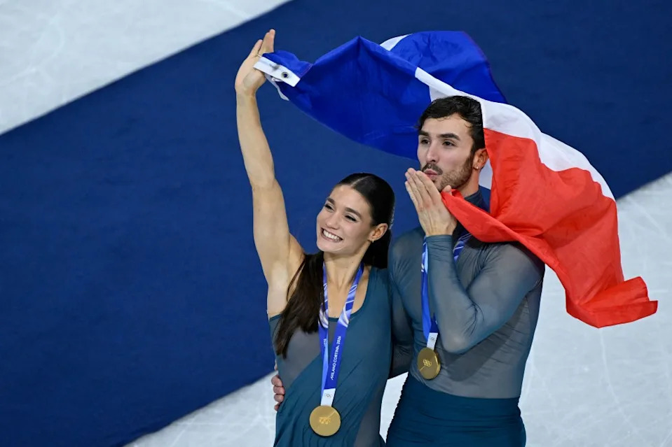 Gold medalists France’s Laurence Fournier Beaudry and Guillaume Cizeron pose after the ice dancing free dance final during the Olympics on Feb. 11, 2026. AFP via Getty Images