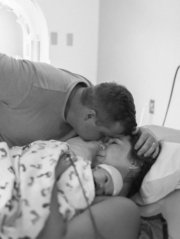 Allison Wilcox, her husband, and newborn daughter. Allison Wilcox