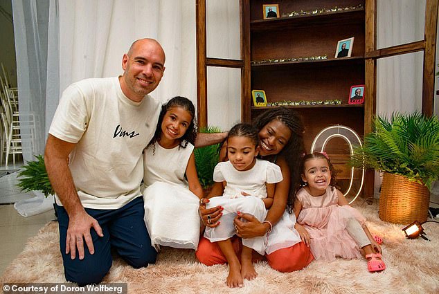 Talia, who is now five, is 'doing great' and the family feels 'hopeful,' Wolfberg said. She's seen center in her mom's lap with her siblings and father