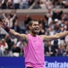 Carlos Alcaraz of Spain celebrates after defeating Jannik Sinner of Italy at the U.S. Open on Sunday in New York City.
