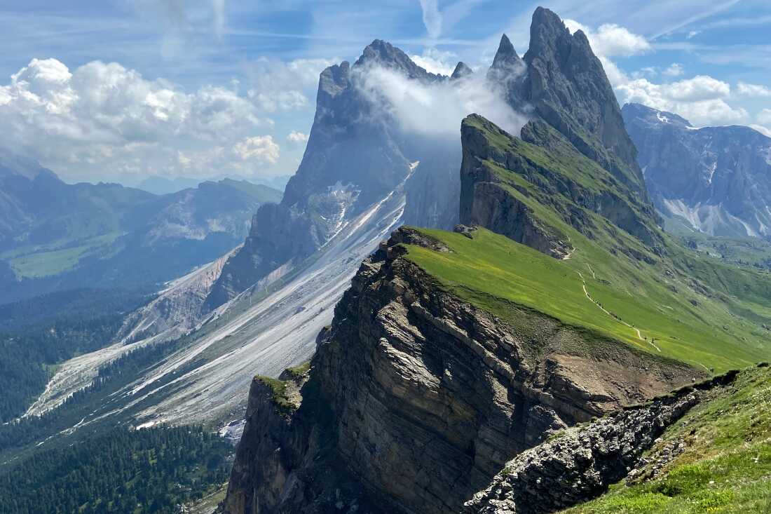 Clouds hang over the 'Seceda' Dolomites mountain in the northern Italian province of South Tyrol, which i