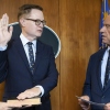 In this photo provided by the Department of Health and Human Secretary, Robert F. Kennedy Jr., right, conducts the swearing-in ceremony of Jim O'Neill as the department's deputy secretary, June 9, 2025, in Washington, D.C.