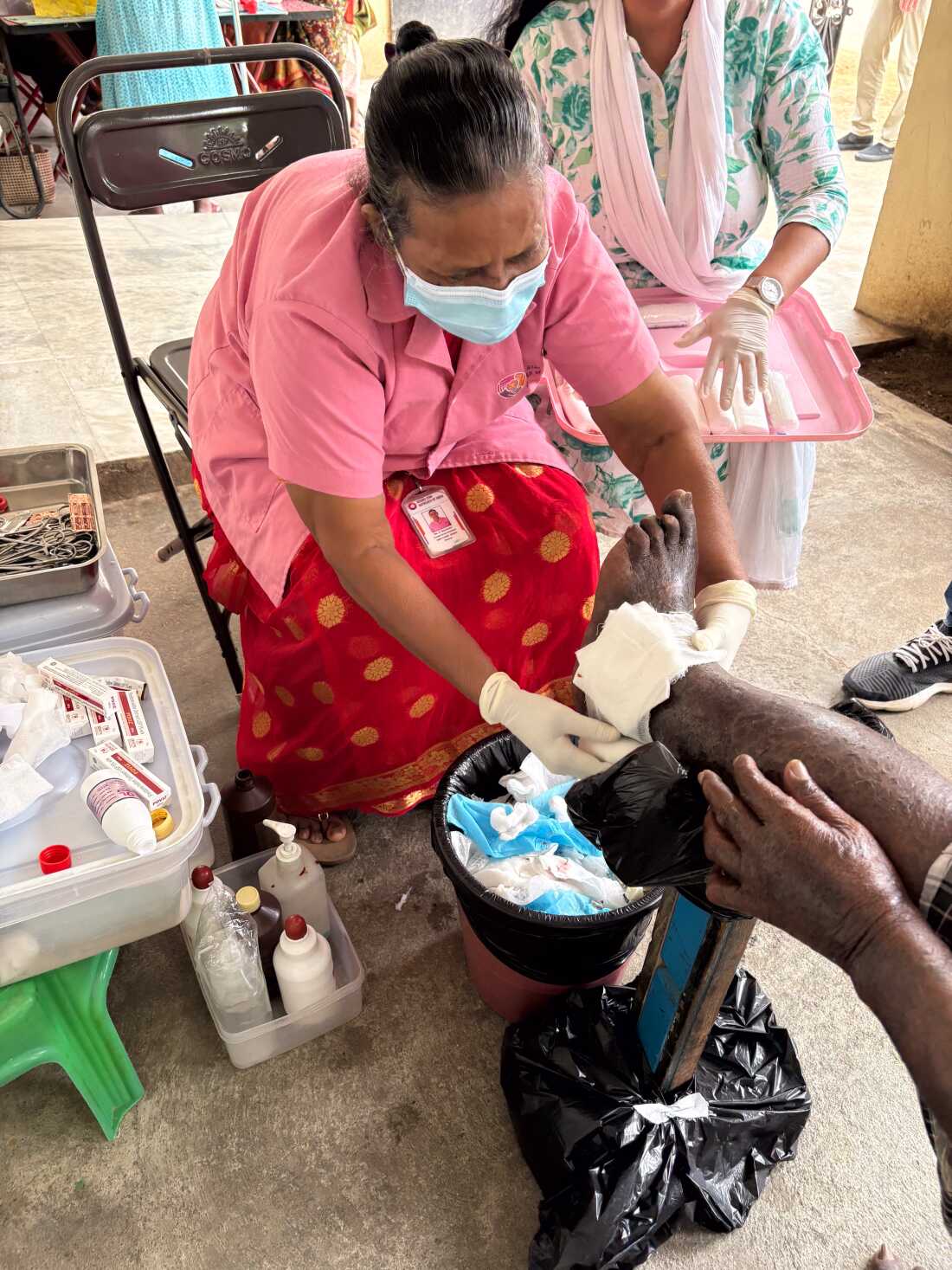 pictures of nurses caring for patients' foot wounds, and foot wounds. This is at Bharathapuram colony.