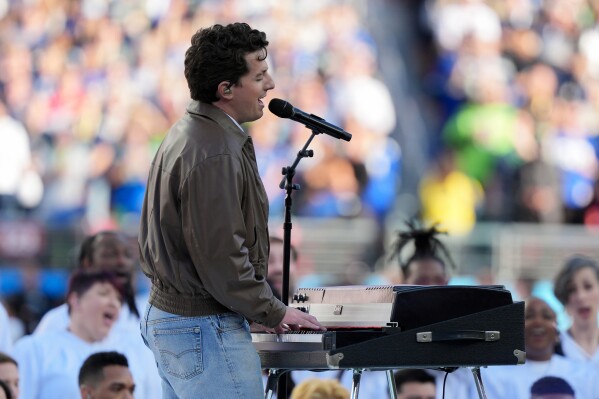Charlie Puth performs the national anthem before the NFL Super Bowl 60 football game between the New England Patriots and the Seattle Seahawks, Sunday, Feb. 8, 2026, in Santa Clara, Calif. (AP Photo/Matt Slocum)