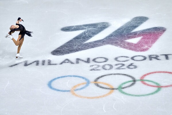 Amber Glenn of the United States competes during the figure skating women's team event at the 2026 Winter Olympics, in Milan, Italy, Sunday, Feb. 8, 2026. (AP Photo/Natacha Pisarenko)
