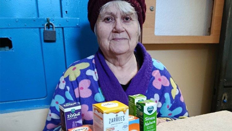 A Ukrainian woman with medicine received from the Pope
