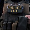 A U.S. Immigration and Customs Enforcement agent is seen in Park Ridge, Ill., Sept. 19, 2025.