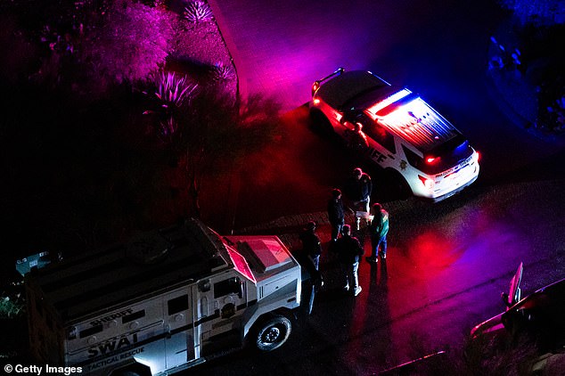 TUCSON, ARIZONA - FEBRUARY 13: In an aerial view, FBI and SWAT units perform operations in a neighborhood approximately two miles from Nancy Guthrie's residence on February 13, 2026 in Tucson, Arizona. Searches continue for Nancy Guthrie, the 84-year-old mother of U.S. journalist and television host Savannah Guthrie, after she went missing from her home on the morning of February 1st.  (Photo by Brandon Bell/Getty Images)