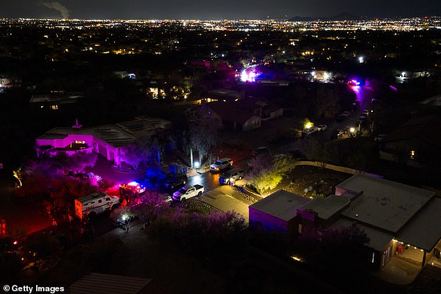 TUCSON, ARIZONA - FEBRUARY 13: In an aerial view, FBI and SWAT units perform operations in a neighborhood approximately two miles from Nancy Guthrie's residence on February 13, 2026 in Tucson, Arizona. Searches continue for Nancy Guthrie, the 84-year-old mother of U.S. journalist and television host Savannah Guthrie, after she went missing from her home on the morning of February 1st.  (Photo by Brandon Bell/Getty Images)