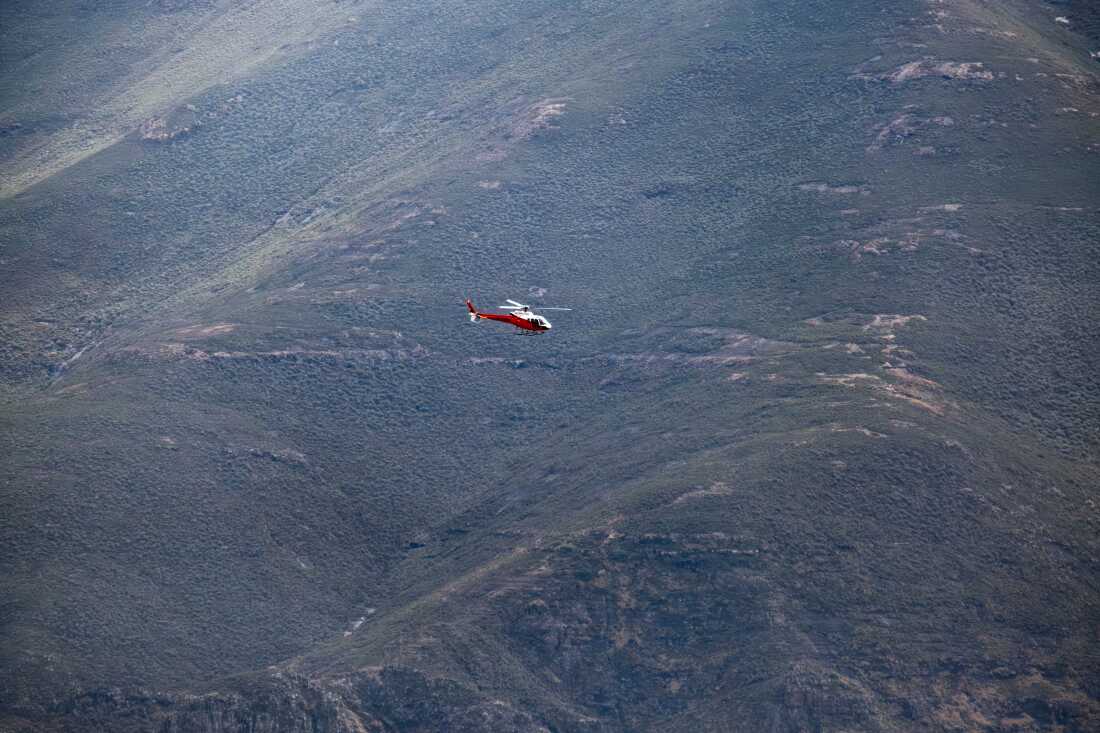 A helicopter operated by Mercy Air transports a medical team from the Lesotho Flying Doctor Services in the highlands of Lesotho. The LFDS relies on helicopters and single engine Cesna airplanes to reach remote communities around the country.