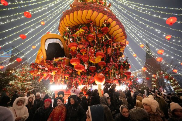 People attend the Lunar New Year festival at Manezhnaya Square in Moscow, Monday, Feb. 16, 2026. (AP Photo/Pavel Bednyakov)