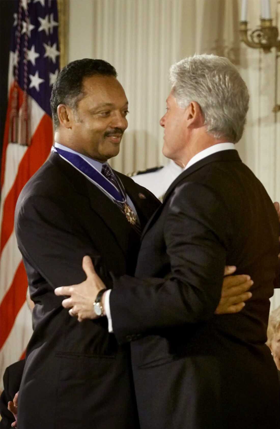 President Clinton hugs Rev. Jesse Jackson, founder and President of the Rainbow/PUSH Coalition, after awarding him the Presidential Medal of Freedom, during ceremonies in the East Room of the White House, Wednesday, Aug. 9, 2000 in Washington, DC.