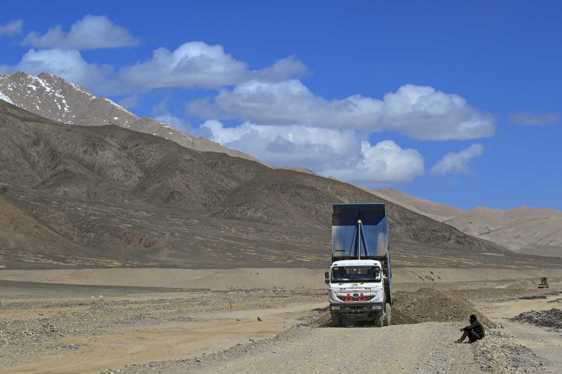 Workers with India's Border Road Organisation construct a road near Demchok in Ladakh, on May 19, 2024.