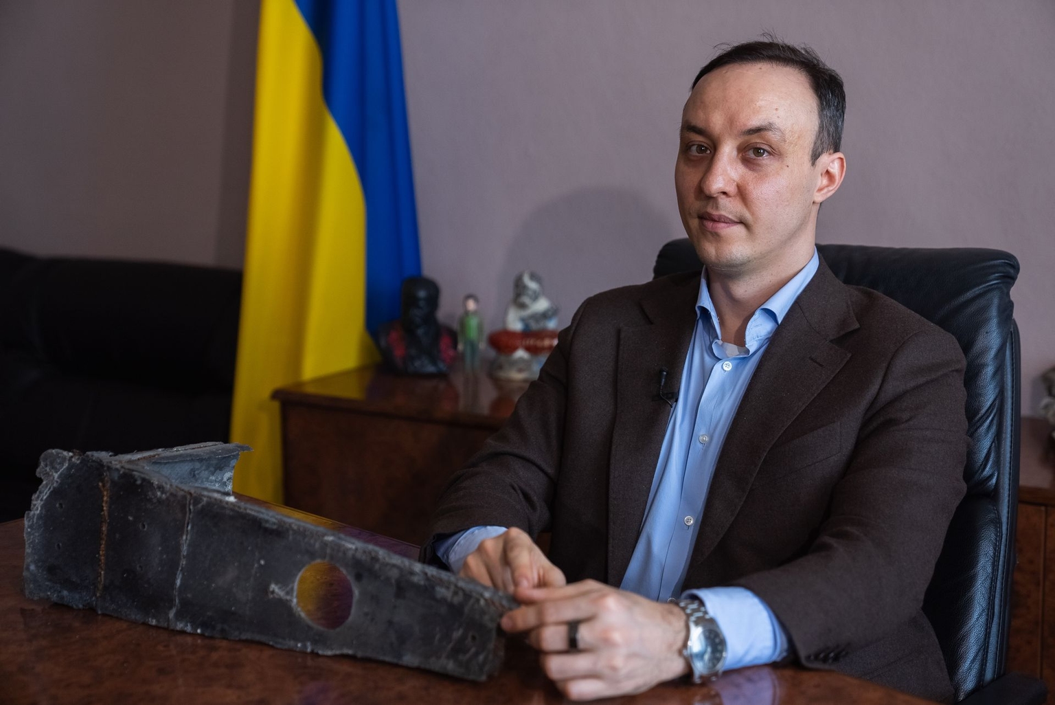 Vladyslav Vlasiuk, Ukraine’s presidential envoy for sanctions policy, poses beside a fragment of a Russian Shahed drone deployed against Ukraine in 2026, in Kyiv, Ukraine, on Feb. 10, 2026.