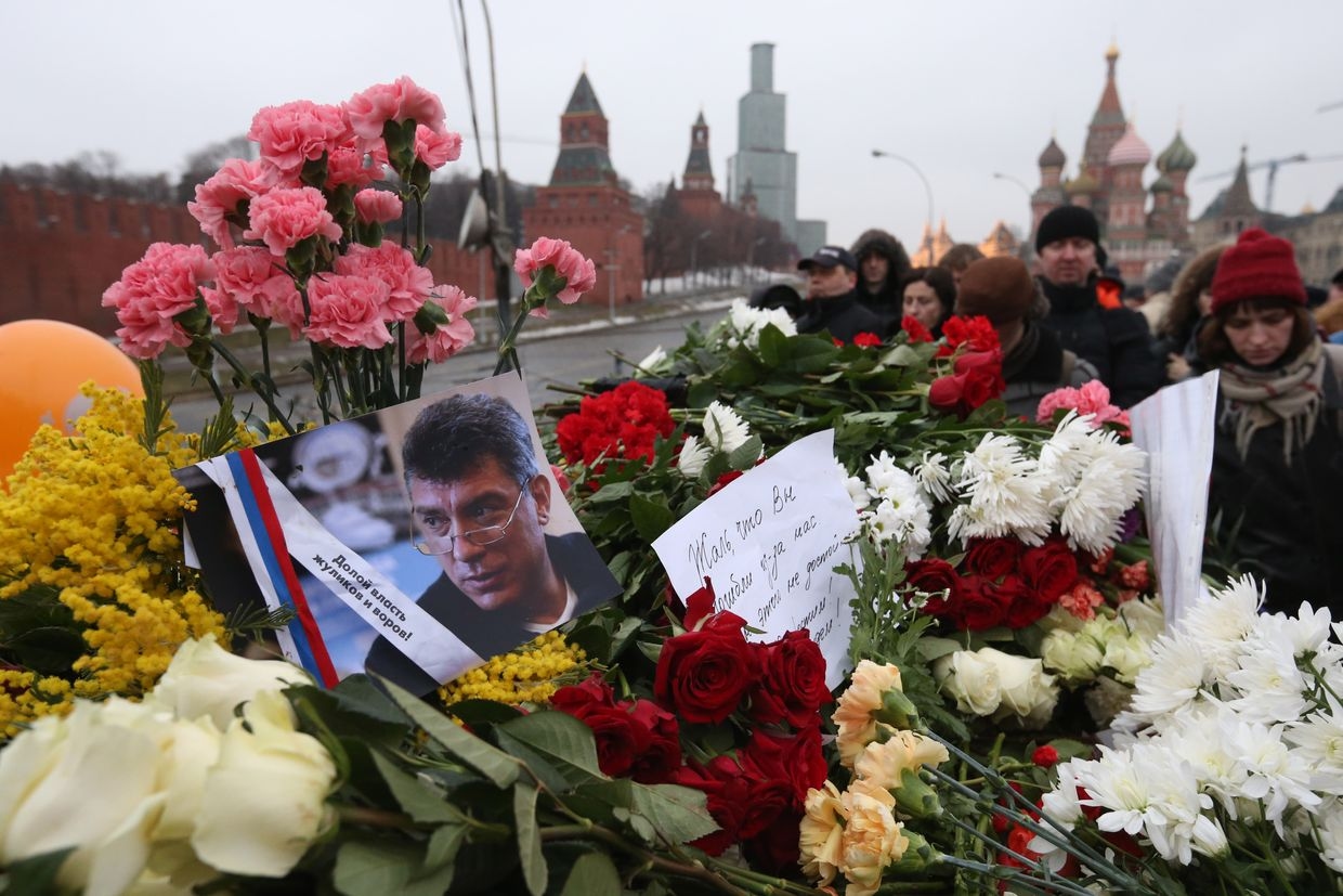 Mourners gather to place tributes at the site where Russian opposition leader and former Deputy Prime Minister Boris Nemtsov was killed near St. Basil’s Cathedral in central Moscow, Russia, on Feb. 28, 2015.