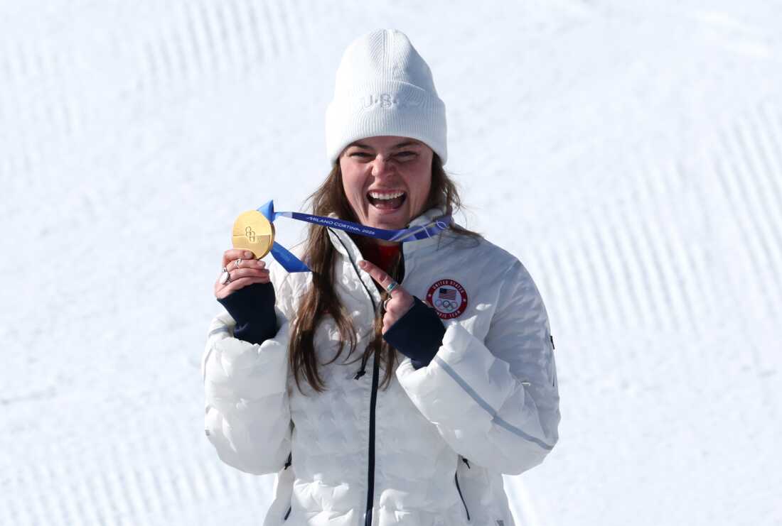 Gold medalist Breezy Johnson celebrates on the podium during the medal ceremony for the Women's Downhill competition at the Milan Cortina 2026 Winter Olympics Cortina d'Ampezzo, Italy, on Feb. 8.