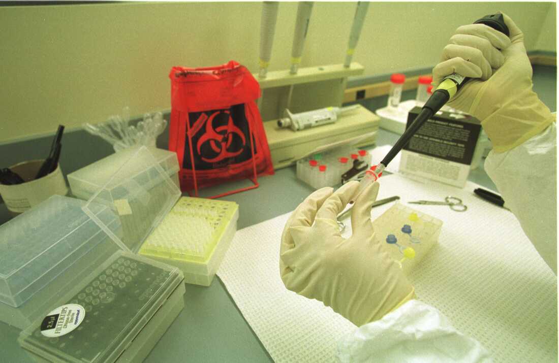 A scientist in the Broward County, Florida, crime lab in 2000 handles DNA extractions that were taken from blood samples of convicted criminals.