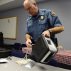 Colorado State Trooper Ron Krasnisky shows the department's oral fluid drug screen testing device, used during a pilot program that ended earlier this year. The system uses a saliva collection device to test impaired drivers for marijuana use as well as other drugs.