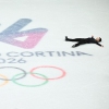Figure skater Li Yu-Hsiang lies on his back on the ice. 