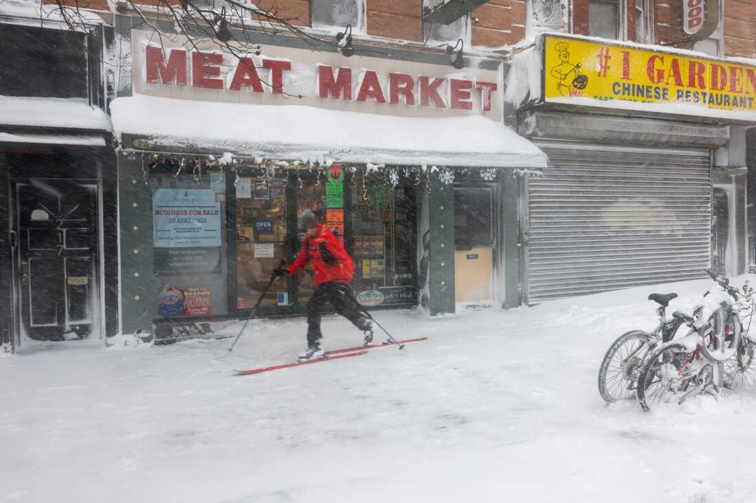 A man skis through the streets of Brooklyn as blizzard conditions continue on Feb. 23 in New York City.