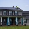 Solar panels are installed on the roof of a home in Frankfort, Ky. in 2023. Residential solar is booming in the U.S. but customer complaints have increased even more.