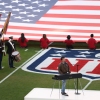 Standing in front of an electronic keyboard set up on a football field, singer Charlie Puth performs the national anthem ahead of this year's Super Bowl on February 8.